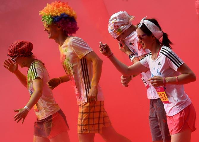 Runners participate in the "Colour Run 2016" at the Luzhniki Olympic Complex in Moscow, Russia