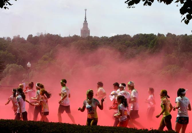Runners participate in the "Colour Run 2016" at the Luzhniki Olympic Complex in Moscow, Russia