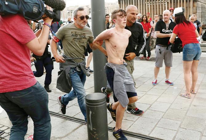 French cops arrest an England fan on Friday. pic/Getty Images   