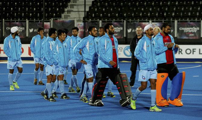 The India team walks round the pitch after lodging a protest concerning the penalty shoot out during the 1st and 2nd place match between Australia and India on day six of the FIH Men
