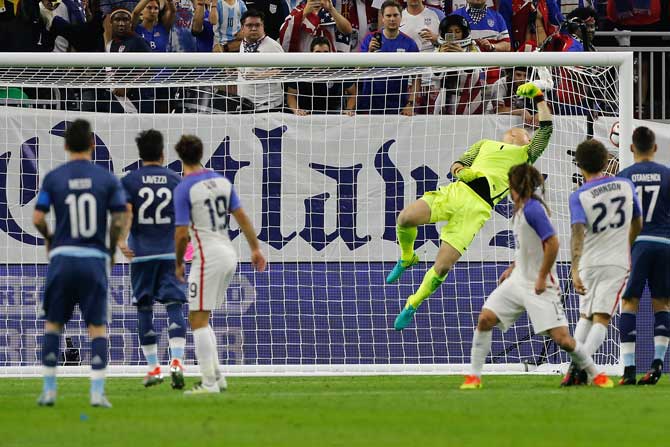 Lionel Messi #10 of Argentina scores a goal against Brad Guzan #1 of United States on a free kick in the first half during a 2016 Copa America Centenario Semifinal match at NRG Stadium on Tuesday in Houston, Texas.
