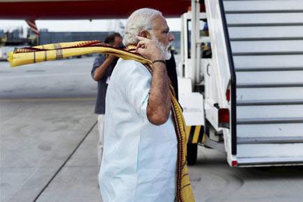 In pictures: Narendra Modi returns to India 