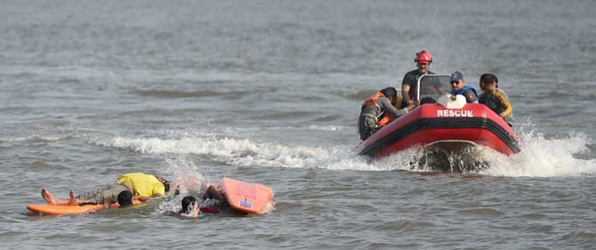 Firefighters carrying out a pre-monsoon rescue mock drill in the Arrabian sea near Marine Drive in Mumbai on Tuesday. PTI 