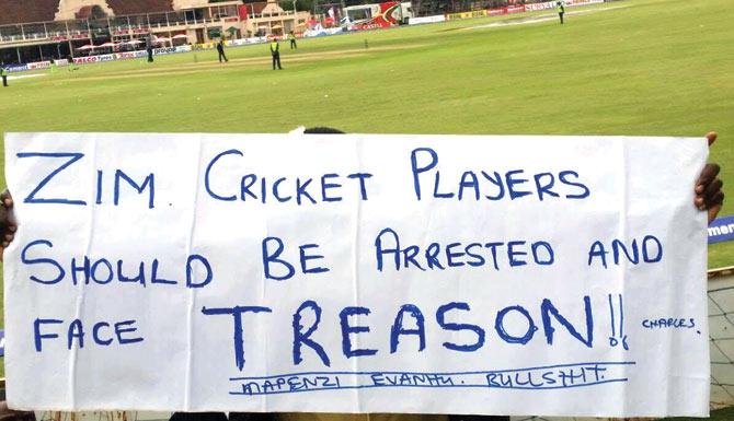A fan expresses his anger through a banner after Zimbabwe