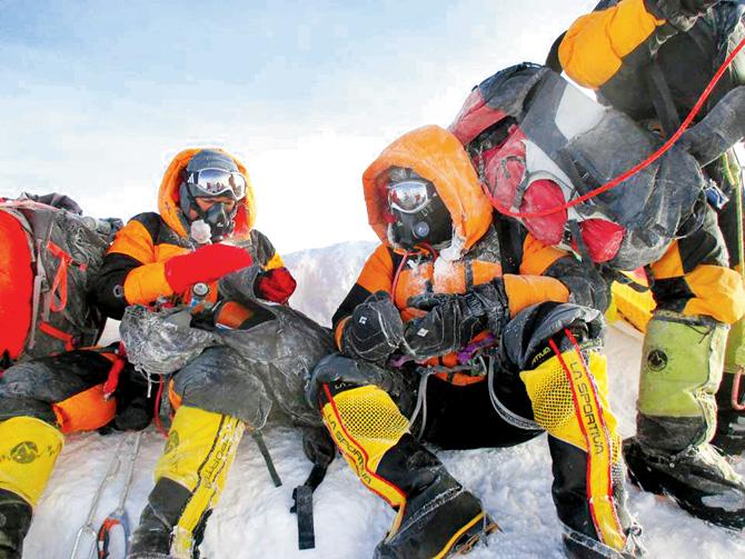 The website of Makalu Adventure claims these pictures of Dinesh and Tarkeshwari Rathod have been clicked at the summit of Mt Everest. Pic/makaluadventure.com