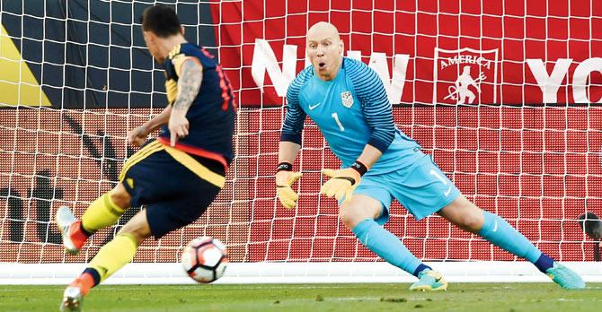 Colombia’s James Rodriguez scores a penalty past USA’s goalkeeper Brad Guzan during the Copa America Centenario match in California, United States on Saturday. pic/AFP