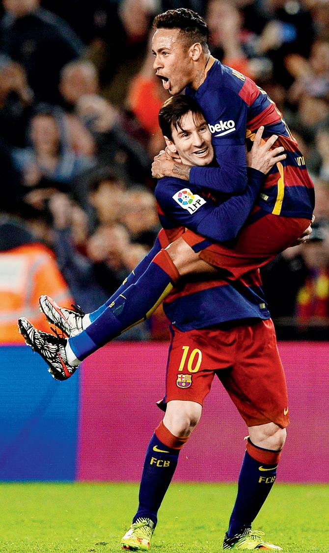 two good: Barcelona forward Lionel Messi celebrates a goal with teammate Neymar during their Spanish League match against Sevilla FC at the Camp Nou Stadium in Barcelona on Sunday. Pic/AFP 