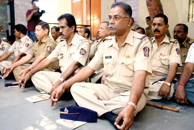 Take a breather: A file picture of cops participating in a stress elimination programme at Bhoiwada.