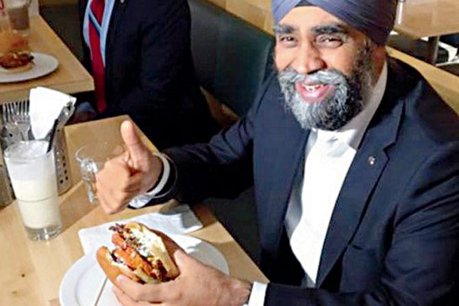 Sajjan stopped by in Vancouver to sample the burger. PIC/Twitter