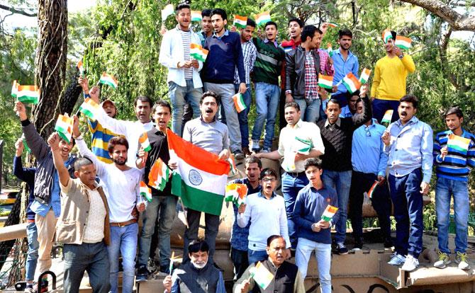 Family members of Pathankot attack martyrs (Jagdish Chand and Sanjeevan Rana) along with youngsters holding a protest against World Twenty20 match between India and Pakistan scheduled to be played in Dharamsala. Pic/PTI