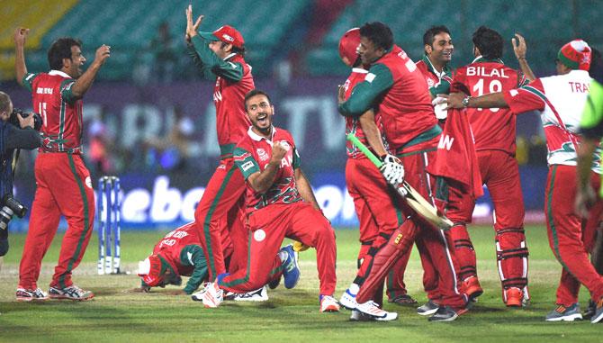 Oman players celebrate after victory over Ireland during their ICC T20 World cup match in Dharamshala on Wednesda. Pic/PTI