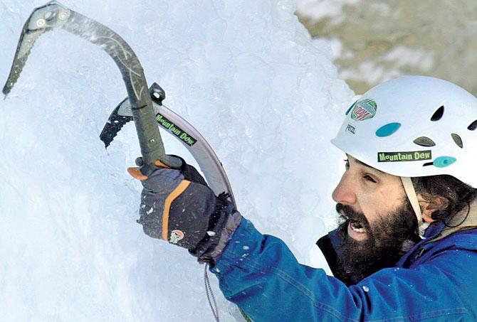 Pranav Rawat uses an ice axe to gain foothold