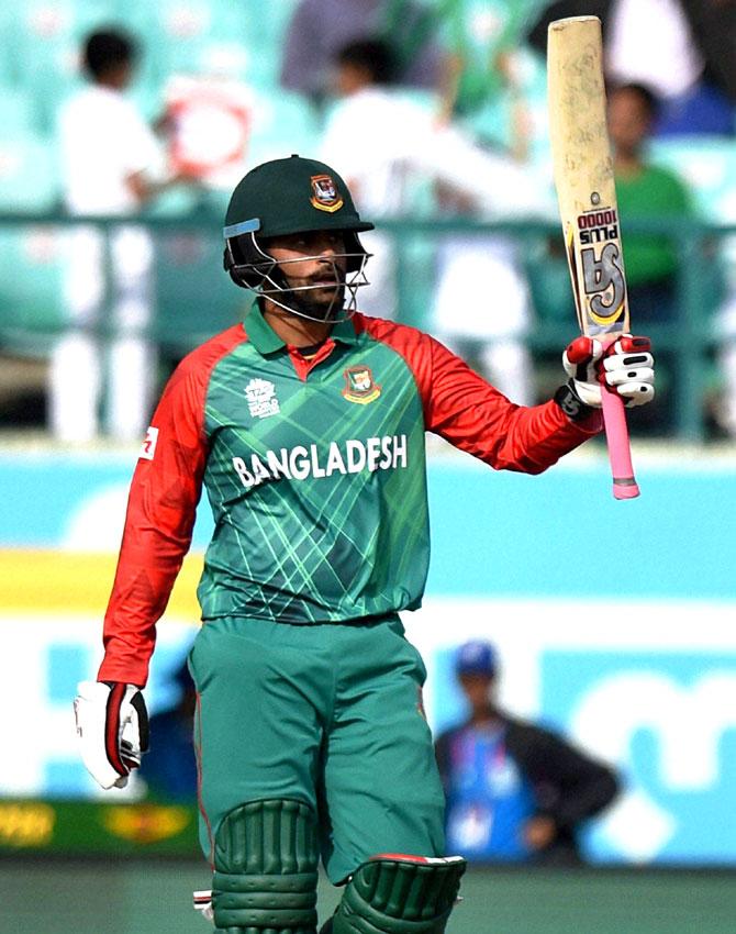 Bangladesh batsman Tamim Iqbal celebrates his fifty against Netherlands during their ICC T20 World Cup match in Dharamsala. Pic/PTI