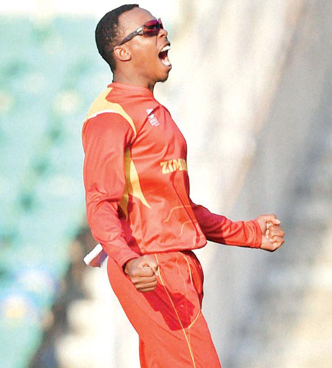 Zimbabwe spinner Wellington Masakadza (4-28) celebrates the fall of a Scotland wicket in Nagpur yesterday. Pic/PTI