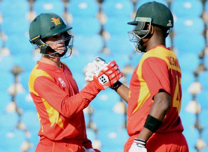 Zimbabwe batsman Elton Chigumbura congratulate Sean Williiams after later