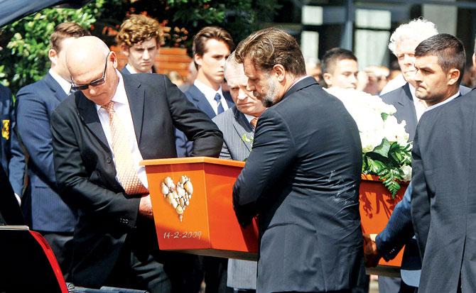 Pallbearers including actor Russell Crowe and Jeff Crowe at Martin