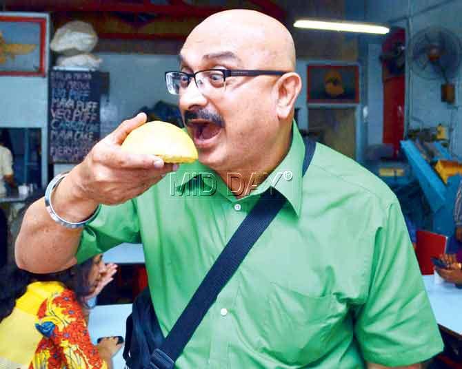 Pankaj Pandhi bites into the Apple pie at Yazdani Bakery. Pic/Datta Kumbhar