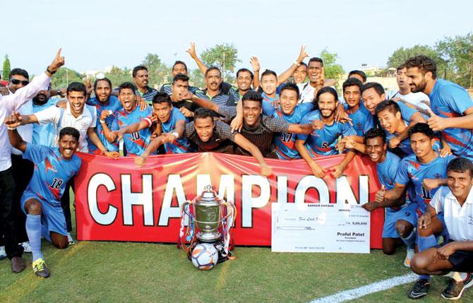 The Services side with the Santosh Trophy at Nagpur yesterday