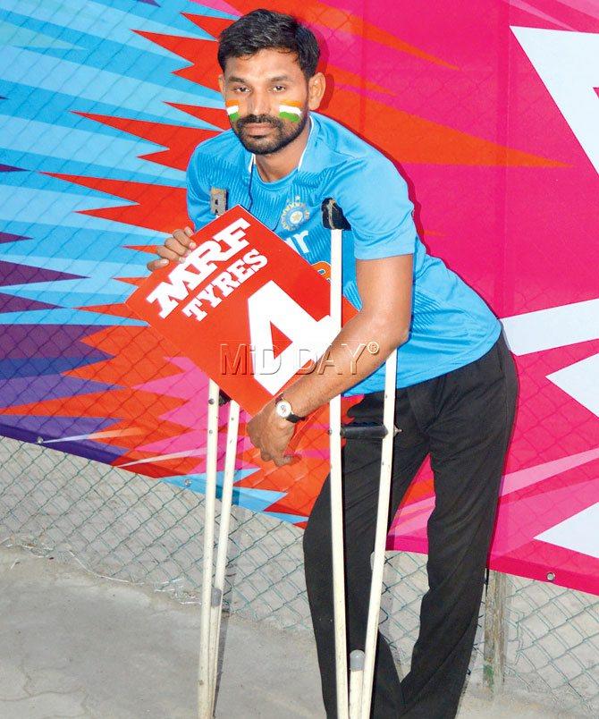 Handicapped fan Mohan Rathod awaits help to get into the VCA Stadium yesterday