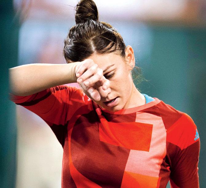 Simona Halep reacts after her defeat