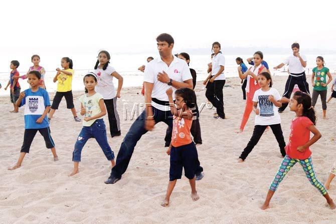 Shifu Alexander Fernandes teaches Kung Fu to the girls on a weekend at Versova beach at 5.30 pm. PIC/NIMESH DAVE