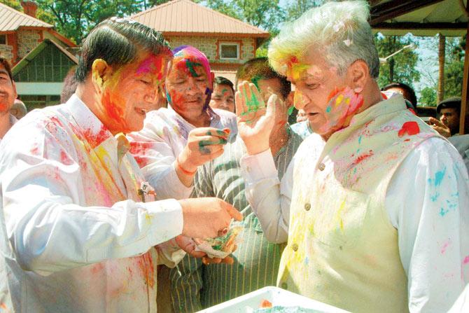 Uttarakhand Chief Minister Harish Rawat celebrates Holi on Thursday. pic/PTI 