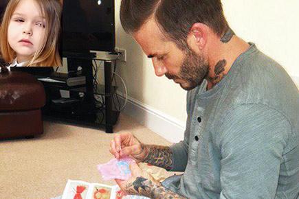 David Beckham stitches dress for daughter's doll