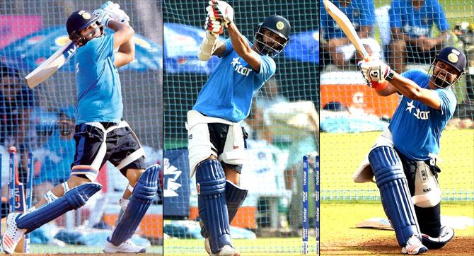 India opener Rohit Sharma bats in the nets at Wankhede Stadium yesterday (Pic/Suresh Karkera) and Shikhar Dhawan and Suresh Raina