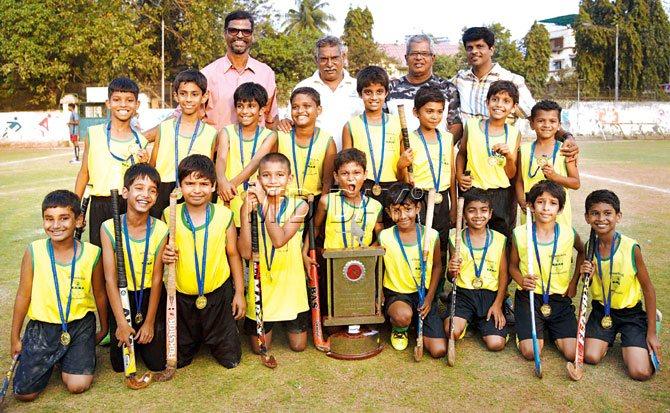 The St Stanislaus U-10 team poses with the Oliver Andrade Trophy. Pics/Suresh KK