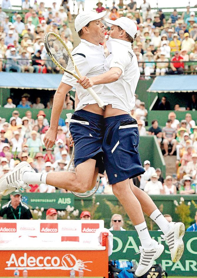 Bob Bryan (left) and Mike Bryan of the United States celebrate after their win over Australia