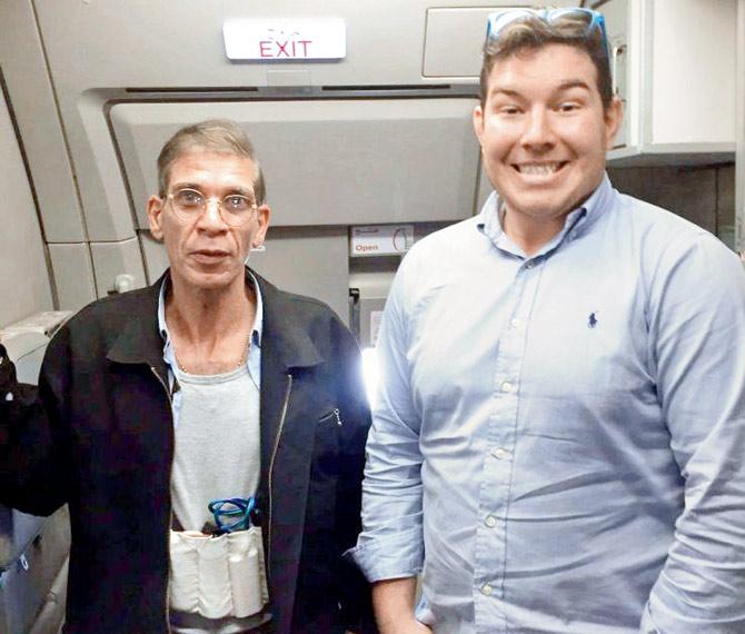 An Aberdeen man posed for a photo with a hijacker (L) who used a fake suicide belt to take control of the plane. Pic/Twitter