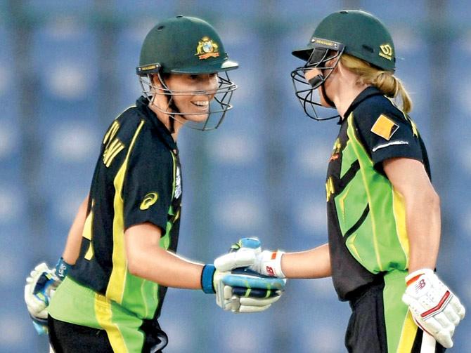 Left: Australia’s Elyse Villani (left) celebrates with Meg Lanning after their WT20 win over Sri Lanka in New Delhi yesterday. Pic/PTI
