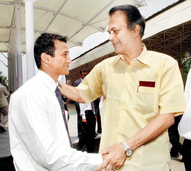 Hemant Waingankar greets Vinit Indulkar after the Mumbai team returned from a successful tour of Pakistan in 2007.  Pic/mid-day archives
