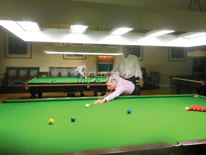 Former Australia cricket captain and mid-day columnist, Ian Chappell plays a game of snooker, watched by opponent Alex Fernandes at the Bombay Gymkhana on Wednesday evening. Pic/Clayton Murzello