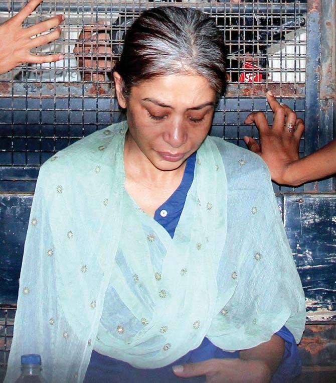 A file pic of Indrani being escorted to court