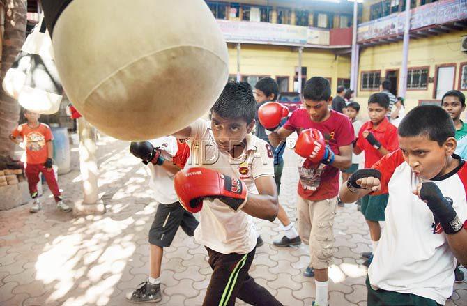 Students of St Mathew’s School in Malwani, Malad, came home with five medals at the MSSA inter-school boxing tournament in January. They have been training for barely a year. Pics/Nimesh Dave
