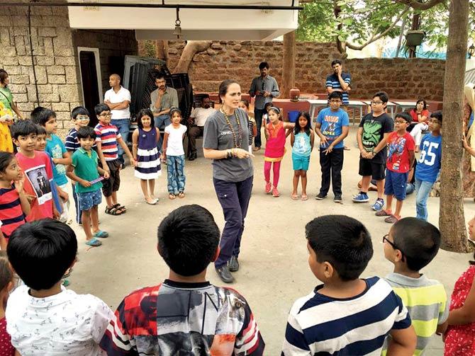 Sanjna Kapoor interacts with children as part of a theatre workshop at Lamakaan in Hyderabad over the weekend