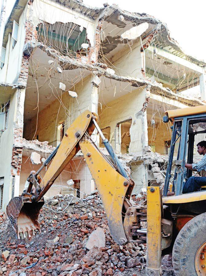 The TMC building being demolished from the front. Pics/Satej Shinde