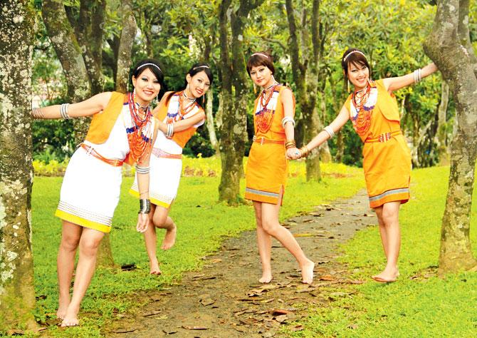 The Tetseo sisters Azi, Kuvelu, Mercy and Alune in traditional  Naga attire