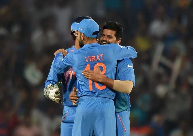 Indian team celebrates the fall of a Kiwi wicket 