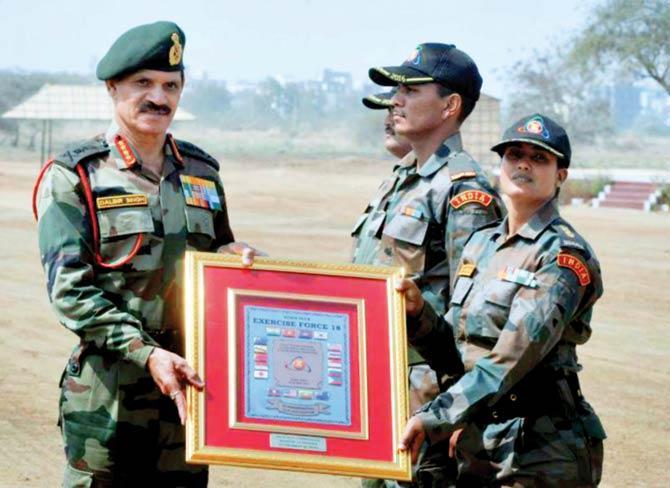 Lt Col Sophia Qureshi accepts a plaque from Army chief Dalbir Singh for successful participation and completion of the exercise