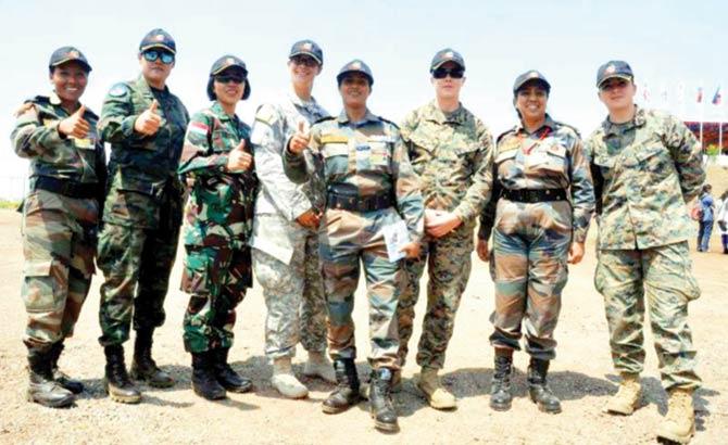 Qureshi (centre) poses for the camera with the other women officers who were a part of ASEAN’s Exercise Force 18