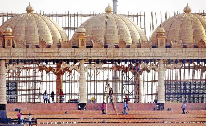 Workers put final touches on the stage which incorporates all the elements of nature. Pics/PTI
