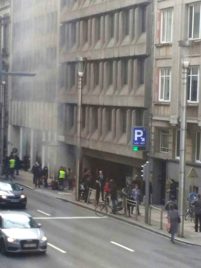 A picture taken on March 22, 2016 shows smoke rising from the Maalbeek underground, in Brussels, following a blast at the station close to the capital