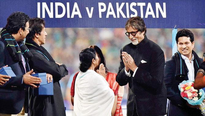 West Bengal Chief Minister Mamata Banerjee felicitates Bollywood actor Amitabh Bachchan as former cricketer Sachin Tendulkar right, Wasim Akram left and Imran Khan look on prior to the World T20 match between India and Pakistan at Eden Gardens in Kolkata on Saturday. Pics/PTI