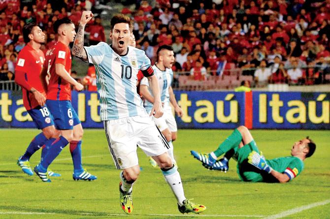 double the joy: Argentina’s mercurial striker Lionel Messi celebrates his team’s second goal, scored by teammate Gabriel Mercado,  during their 2018 FIFA World Cup qualifier against Chile at the National Stadium in Santiago, Chile on Thursday night. Pic/AP, PTI