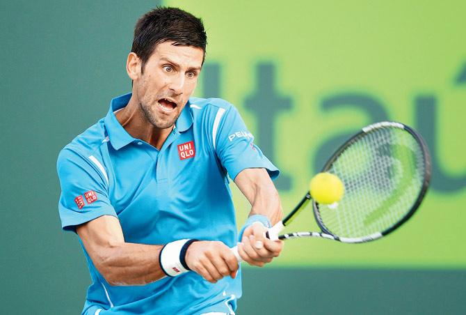 Serbian Novak Djokovic plays a backhand against Joao Sousa of Portugal in their third-round match of the Miami Open at Crandon Park Tennis Center in Florida on Sunday. Pic/AFP 