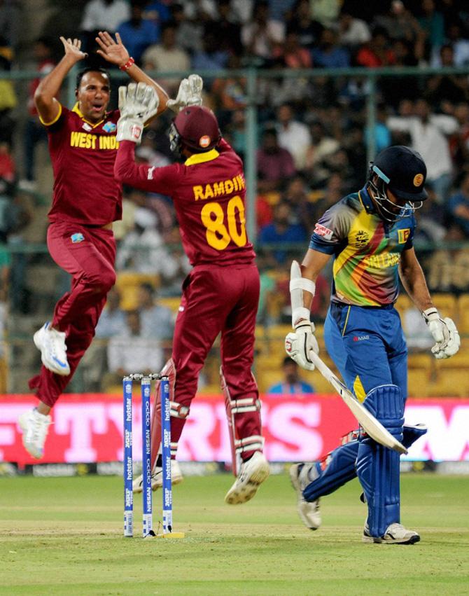 West Indies bowler Samuel Badree with team mates celebrate the wicket of Siriwardene of Sri Lanka during the ICC World T20 match between West Indies and Sri Lanka at Chinnaswamy Stadium in Bengaluru on Sunday. Pic/PTI
