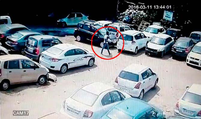 CCTV grabs of the car theft, where the man is seen stealing Jain’s SUV on March 3. The accused appeared to be talking on the phone while entering the parking lot