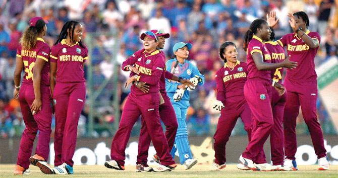 West Indies players celebrate after their victory over India during the Women’s World T20 match at the Punjab Cricket Association Stadium in Mohali yesterday. Pic/PTI
